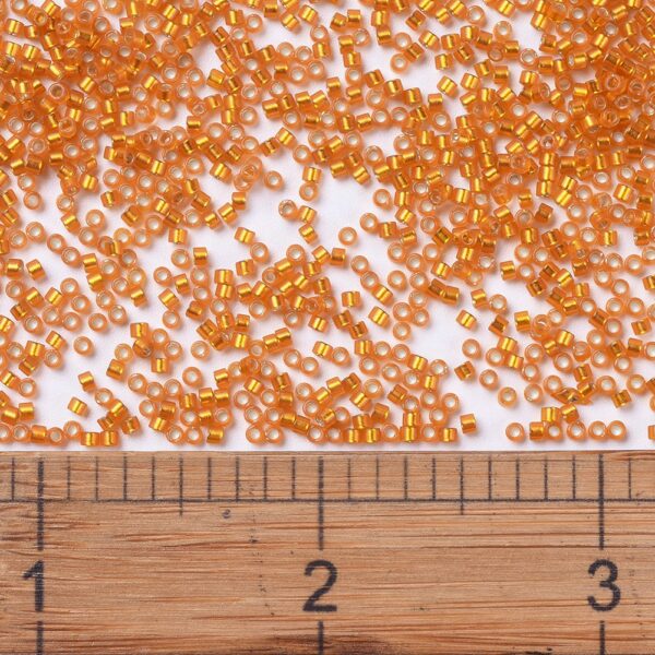 48319b16630821c3f622fef497c2e211 MIYUKI DB0681 Delica Beads 11/0 - Transparent Dyed Semi-Frosted Silver Lined Orange, 100g/bag
